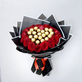 Bouquet of red roses with gold chocolate candies shaped like a heart on a white background